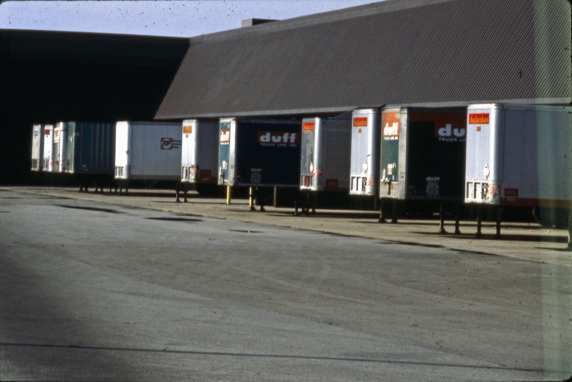 Trailers backed into the loading docks of a warehouse
